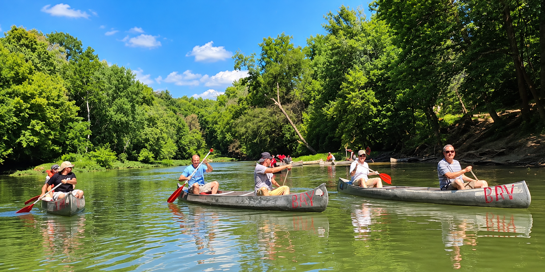 Family canoeing on the Red River